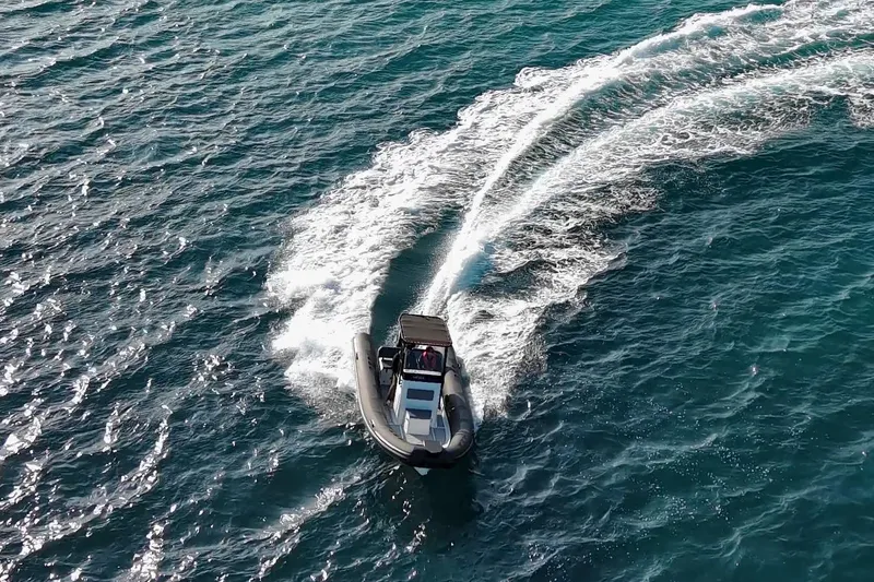 Slide: The Image of Overhead view of 2026 Northstar VEGA 6.4 boat docked by a concrete pier. - 21