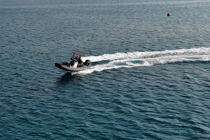 Slide: The Image of 2026 Northstar VEGA 6.4 boat cruising on open water, leaving a wake behind. - 7