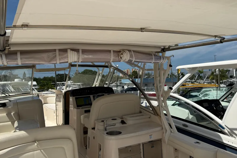 Slide: The Image of 2023 Grady-White Freedom 335 boat interior with helm and seating area. - 18