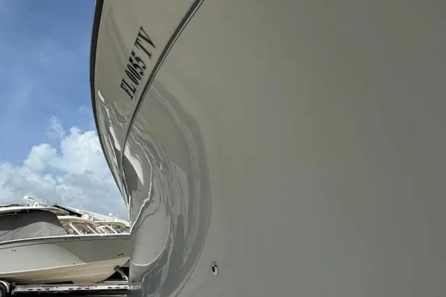 Slide: The Image of 2023 Grady-White Freedom 335 boat hull with clear sky background. - 41