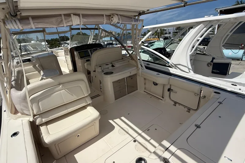 Slide: The Image of 2023 Grady-White Freedom 335 boat interior with seating and helm station. - 7
