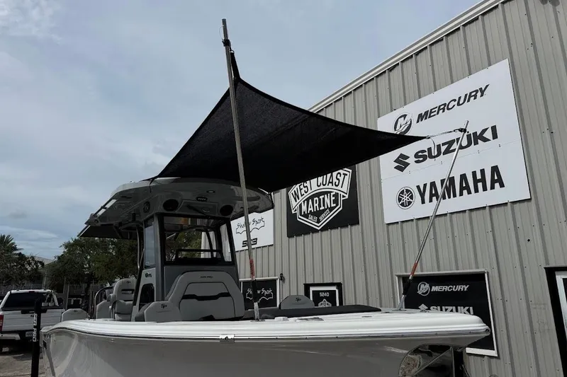 Slide: The Image of 2026 Sea Pro 245 Sandbar boat with canopy at West Coast Marine dealership. - 10