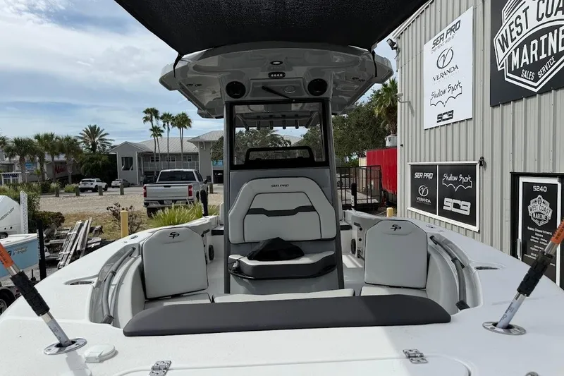 Slide: The Image of 2026 Sea Pro 245 Sandbar boat at West Coast Marine dealership, showcasing interior seating and design. - 12