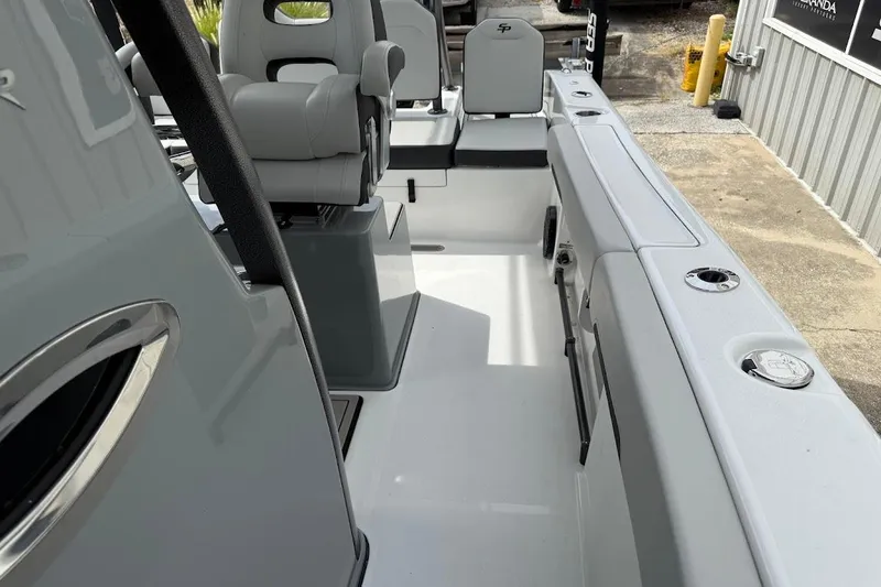 Slide: The Image of 2026 Sea Pro 245 Sandbar boat interior with seating and storage features. - 14