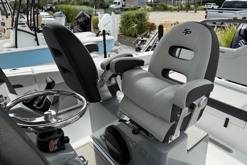 Slide: The Image of 2026 Sea Pro 245 Sandbar boat interior with steering wheel and comfortable seating. - 15