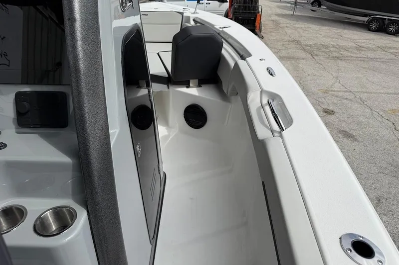 Slide: The Image of 2026 Sea Pro 245 Sandbar boat interior with seating and cup holders. - 21