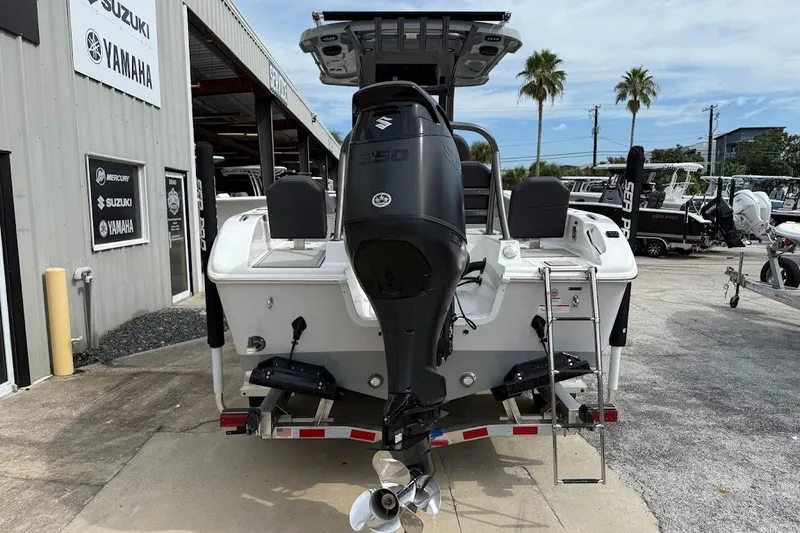 Slide: The Image of 2026 Sea Pro 245 Sandbar boat with Suzuki engine at dealership. - 4
