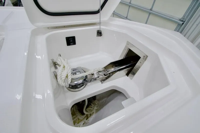 Slide: The Image of Anchor compartment of 2026 Regulator 28 boat with rope and winch system. - 27