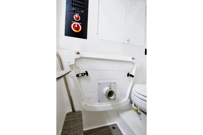 Slide: The Image of 2026 Regulator 28 boat interior with control panel and toilet area. - 29