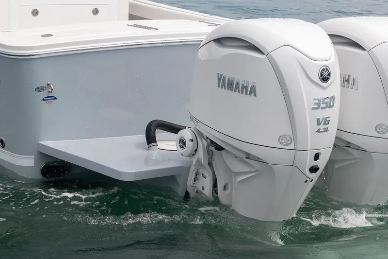 Slide: The Image of 2026 Regulator 28 boat with dual Yamaha 350 V6 outboard engines on water. - 40