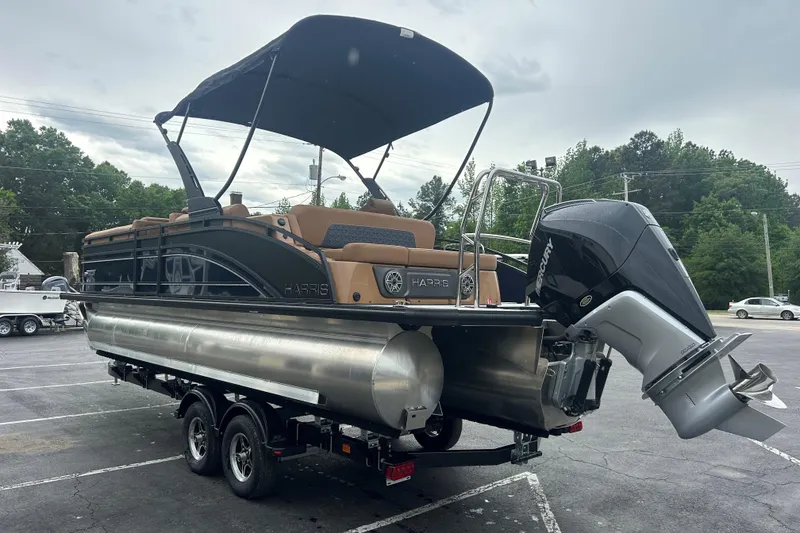 Slide: The Image of 2026 Harris FloteBote Solstice 250 SL pontoon boat with Mercury outboard motor on trailer. - 4