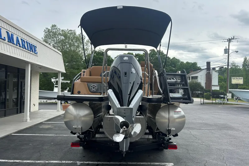 Slide: The Image of 2026 Harris FloteBote Solstice 250 SL pontoon boat at a marine dealership. - 5