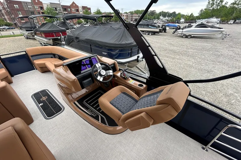 Slide: The Image of Interior view of 2026 Harris FloteBote Solstice 250 SL pontoon boat with luxurious seating and modern dashboard. - 8
