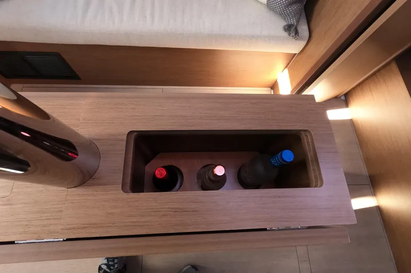 Slide: The Image of Built-in wine storage on 2021 Beneteau Oceanis 38.1 yacht interior. - 17