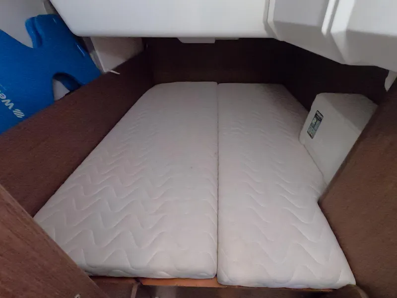Slide: The Image of Cabin interior of 2021 Beneteau Oceanis 38.1 with twin mattresses. - 24