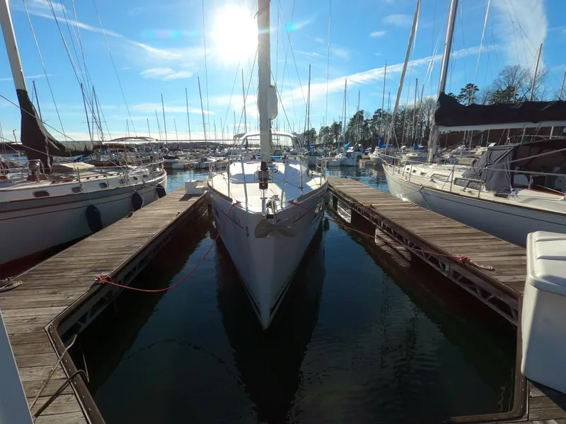 Slide: The Image of Beneteau Oceanis 38.1 sailboat docked in marina, 2021 model, sunny day. - 28