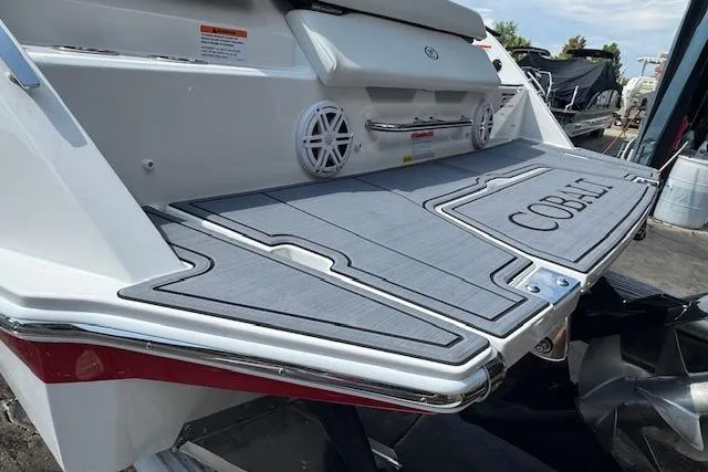 Slide: The Image of 2026 Cobalt CS23 boat swim platform with sleek design and integrated speakers. - 11