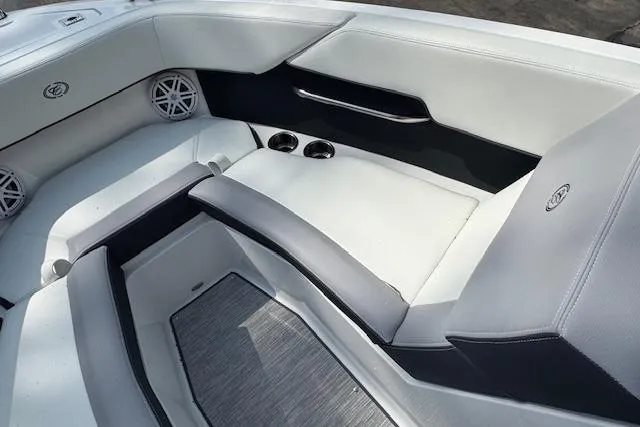Slide: The Image of 2026 Cobalt CS23 boat interior with sleek white seating and modern design elements. - 19