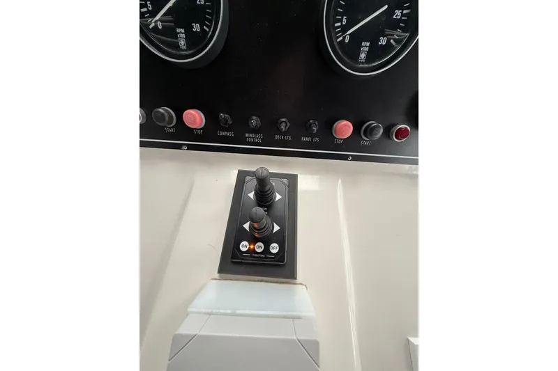 Slide: The Image of Control panel of 1995 Ocean Alexander 486 yacht with gauges and switches. - 14