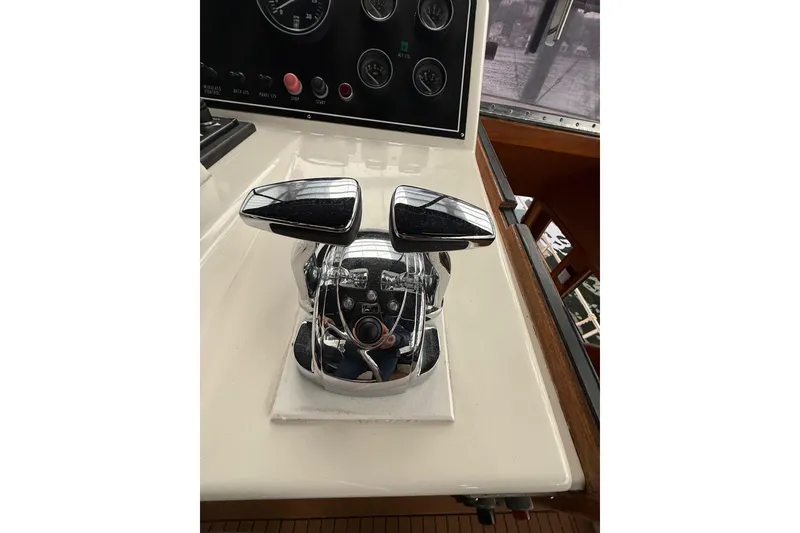Slide: The Image of Chrome throttle controls on a 1995 Ocean Alexander 486 yacht dashboard. - 15