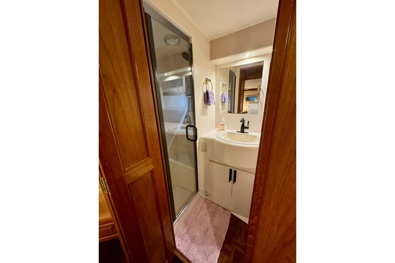 Slide: The Image of Bathroom interior of 1995 Ocean Alexander 486 yacht with shower and sink. - 35