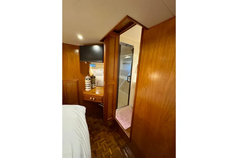 Slide: The Image of Luxurious 1995 Ocean Alexander 486 yacht interior with wood paneling and modern amenities. - 36