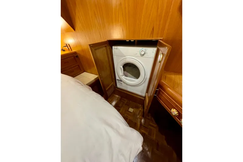 Slide: The Image of Laundry area with washer in 1995 Ocean Alexander 486 yacht cabin. - 37