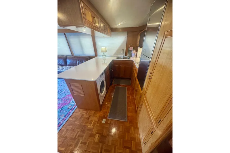 Slide: The Image of Interior of 1995 Ocean Alexander 486 yacht with kitchen and seating area. - 40