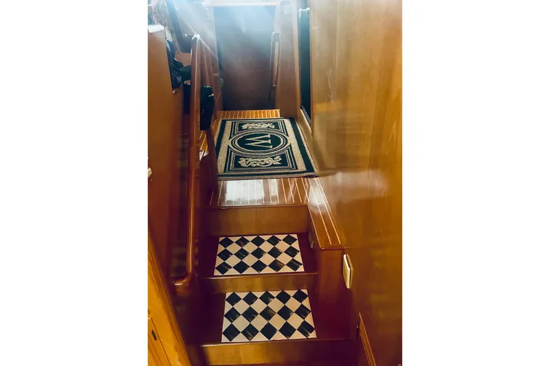 Slide: The Image of Staircase with checkered steps on 1995 Ocean Alexander 486 yacht interior. - 41