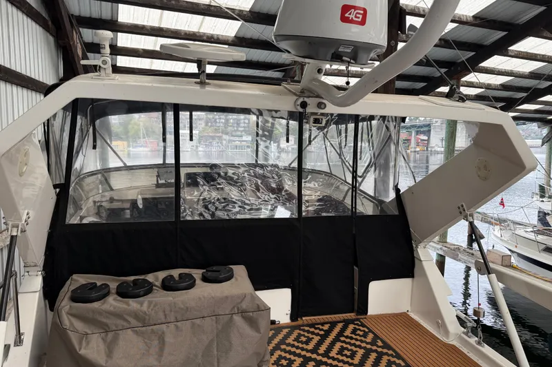 Slide: The Image of 1995 Ocean Alexander 486 yacht interior with covered cockpit and radar equipment. - 51