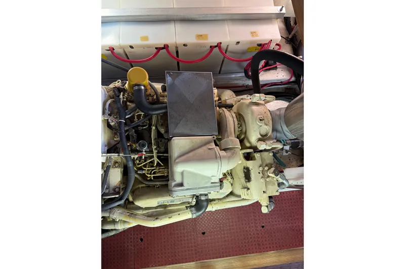 Slide: The Image of Engine compartment of a 1995 Ocean Alexander 486 yacht, showcasing mechanical components. - 52