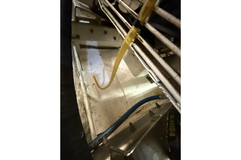 Slide: The Image of Engine compartment of 1995 Ocean Alexander 486 yacht, showing hoses and wiring. - 57