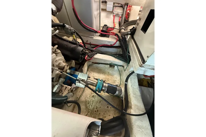 Slide: The Image of Engine compartment of a 1995 Ocean Alexander 486 yacht, showing wiring and components. - 58