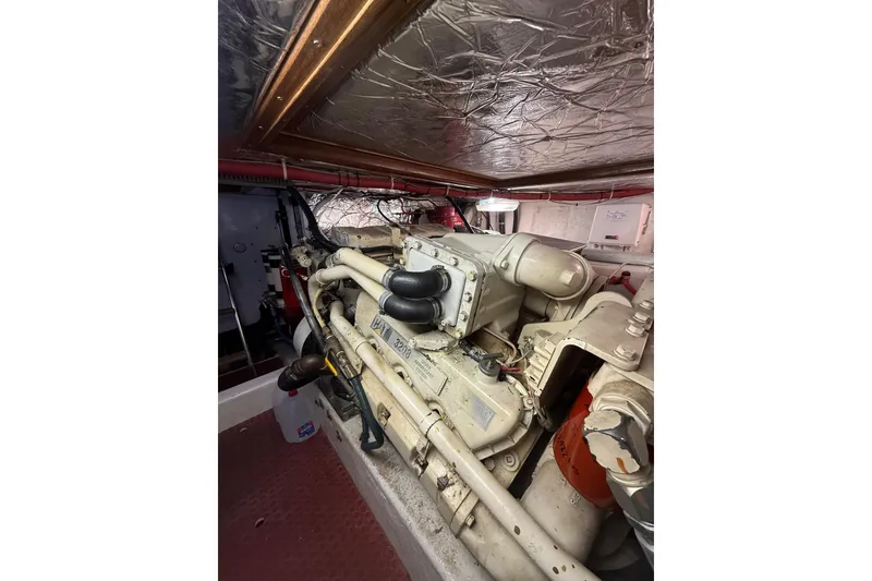 Slide: The Image of Engine room of 1995 Ocean Alexander 486 yacht, showcasing mechanical components. - 59