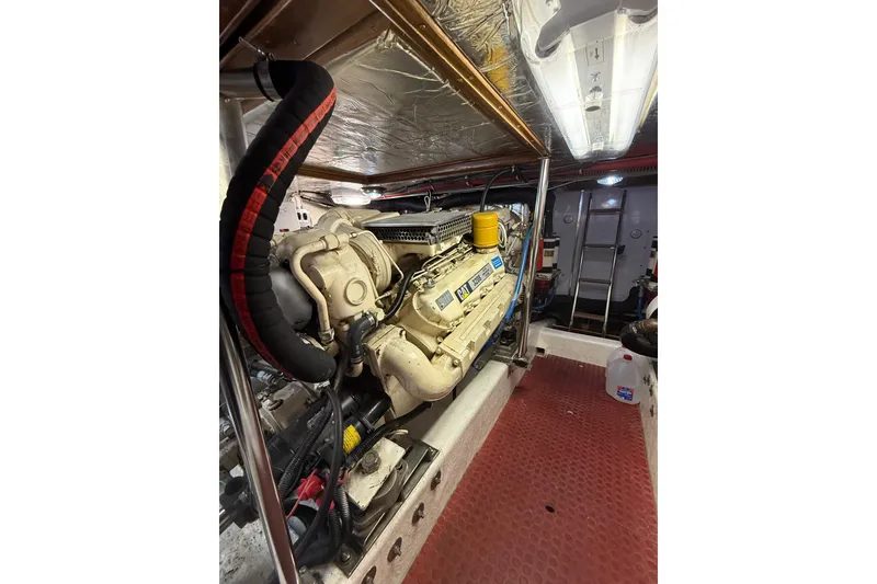 Slide: The Image of Engine room of 1995 Ocean Alexander 486 yacht, featuring a Caterpillar engine. - 60