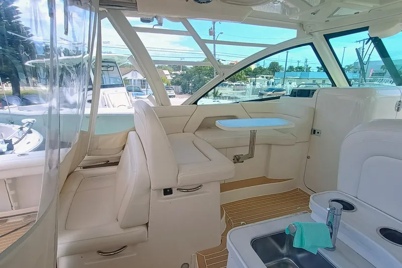 Slide: The Image of 2021 Grady-White Freedom 375 boat interior with seating and table. - 10