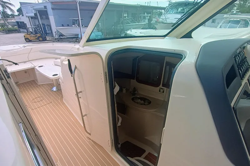 Slide: The Image of 2021 Grady-White Freedom 375 boat interior with cabin and seating area. - 15