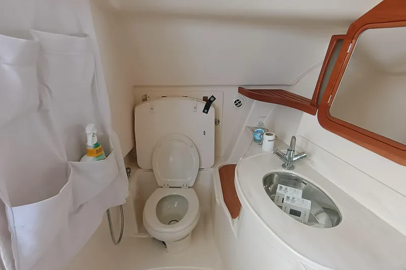 Slide: The Image of 2021 Grady-White Freedom 375 boat bathroom with toilet, sink, and storage. - 16