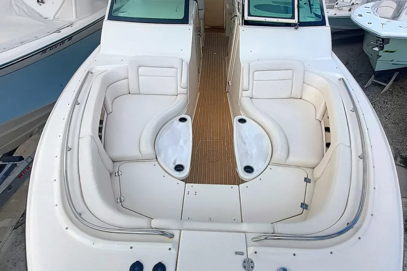 Slide: The Image of 2021 Grady-White Freedom 375 boat interior with white seating and wooden flooring. - 21
