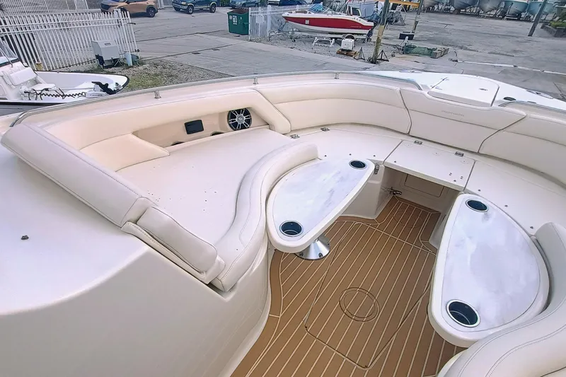 Slide: The Image of 2021 Grady-White Freedom 375 boat interior with cushioned seating and wooden flooring. - 23