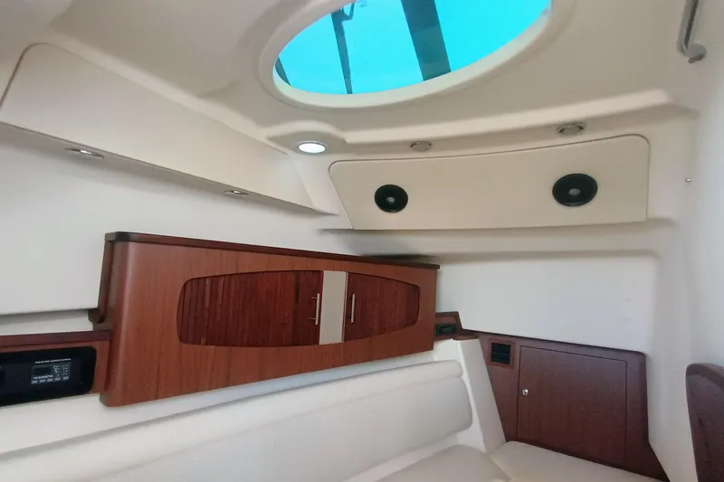 Slide: The Image of 2021 Grady-White Freedom 375 cabin interior with wood cabinetry and skylight. - 30