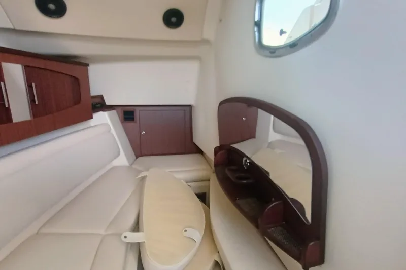 Slide: The Image of 2021 Grady-White Freedom 375 cabin interior with seating and wooden cabinetry. - 31