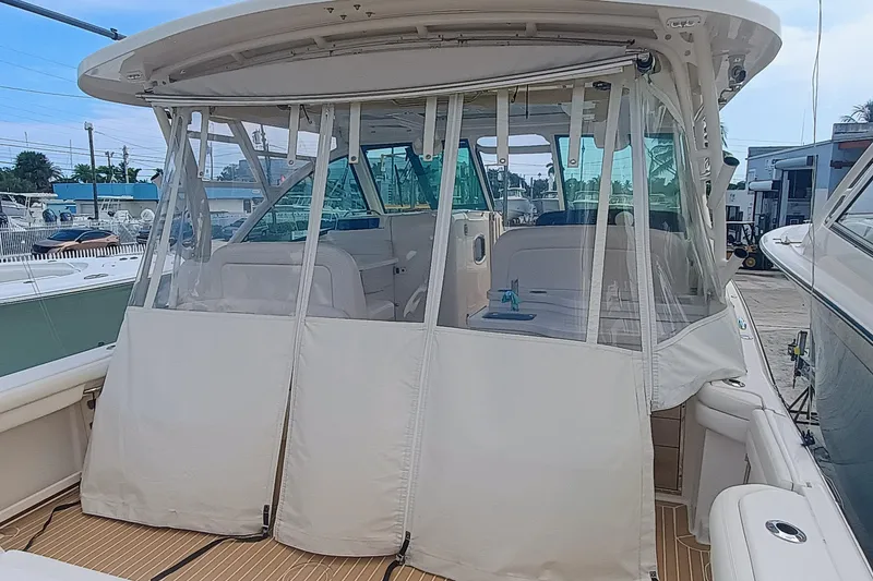 Slide: The Image of 2021 Grady-White Freedom 375 boat with enclosed cockpit, docked at marina. - 6