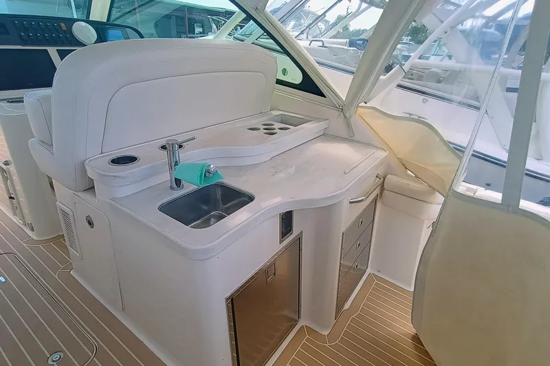 Slide: The Image of 2021 Grady-White Freedom 375 boat interior with sink and storage area. - 9
