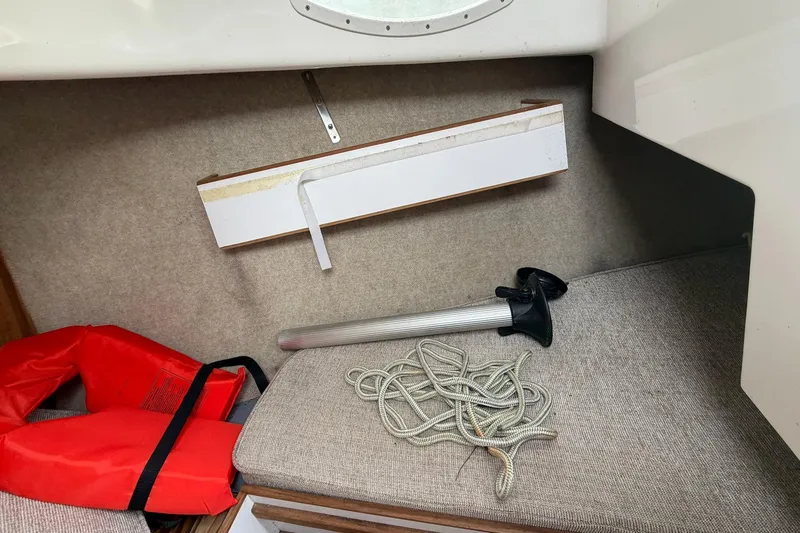 Slide: The Image of Interior of a 2014 Com-Pac Horizon Day Cat with life jacket and rope. - 10