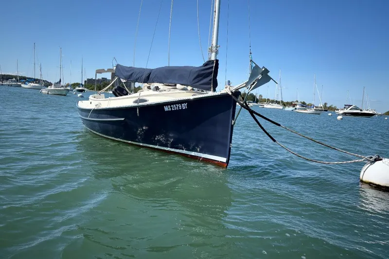 Slide: The Image of 2014 Com-Pac Horizon Day Cat sailboat moored in a sunny marina. - 3