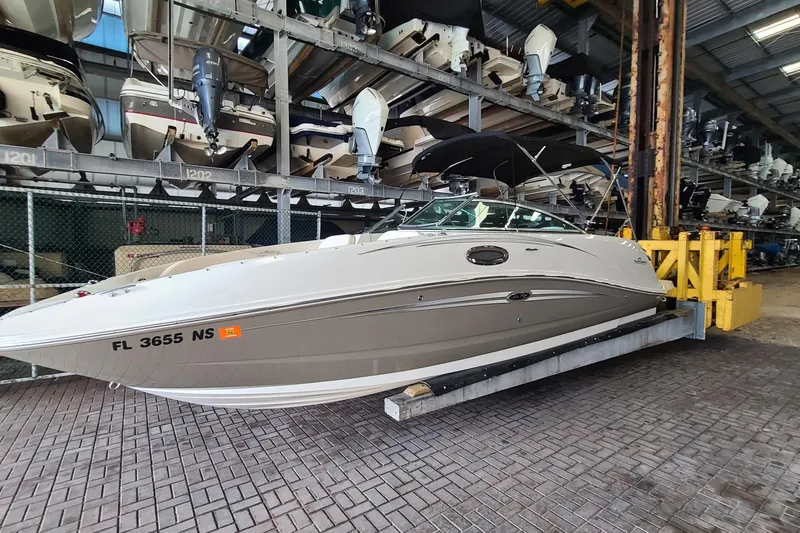Slide: The Image of 2008 Sea Ray 260 Sundeck boat in storage facility, side view. - 1
