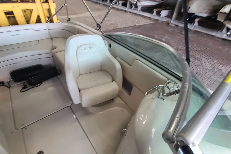 Slide: The Image of Interior of a 2008 Sea Ray 260 Sundeck boat with white seating. - 20