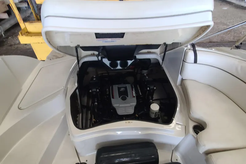 Slide: The Image of 2008 Sea Ray 260 Sundeck engine compartment with open hatch, showcasing interior details. - 22