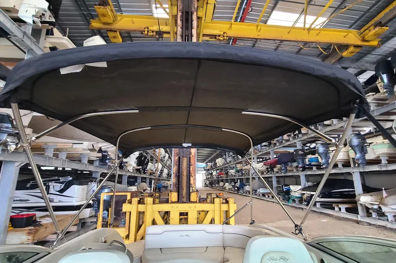 Slide: The Image of 2008 Sea Ray 260 Sundeck in storage facility with protective canopy. - 7